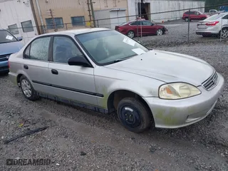 1999 Honda Civic DX with VIN 1HGEJ6628XL028492, listed as a IAAI auction lot 42071358 with 285,769 mi miles. Bid and sale history available at carsss.com. Image 1.
