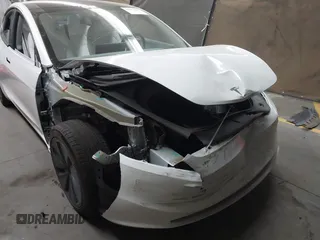 2024 Tesla Model 3 with VIN 5YJ3E1EA9RF836300, listed as a IAAI auction lot 41988009 with 9,989 mi miles. Bid and sale history available at carsss.com. Image 6.