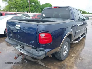 2003 Ford F-150 XLT with VIN 1FTRW07L33KC83234, listed as a IAAI auction lot 41894573 with 215,232 mi miles. Bid and sale history available at carsss.com. Image 4.