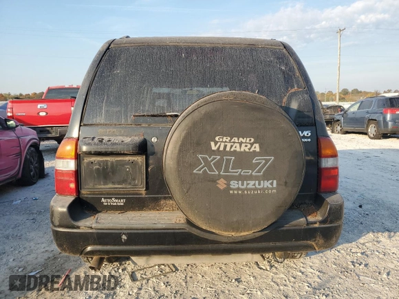 2001 Suzuki XL7 Standard z VIN JS3TX92V514102993, wystawiony jako Copart lot #76669614 z przebiegiem 65 789 mil mil oraz Szkoda całkowita • Salvage title. Historia ofert i sprzedaży dostępna na DreamBid. Obrazek 6.