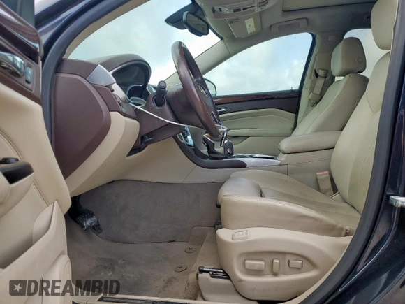 2016 Cadillac SRX Performance Collection with VIN 3GYFNCE32GS507625, listed as a Copart auction lot 61575625 with 47,427 mi miles and Salvage title. Bid and sale history available at DreamBid. Image 7.