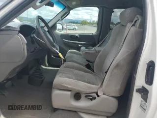 2002 Ford F-150 XL with VIN 1FTRX18L62KC53807, listed as a Copart auction lot 57463075 with 173,301 mi miles and Salvage title. Bid and sale history available at DreamBid. Image 7.