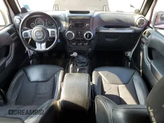 2013 Jeep Wrangler Unlimited Sport z VIN 1C4HJWDG9DL581643, wystawiony jako Copart lot #60775805 z przebiegiem 148 959 mil mil oraz Czysty tytuł • Clean title. Historia ofert i sprzedaży dostępna na DreamBid. Obrazek 8.