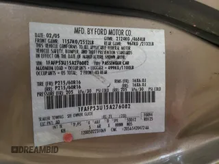 2005 Ford Taurus SE with VIN 1FAFP53U15A276082, listed as a Copart auction lot 52015285 with 103,479 mi miles and Salvage Title. Bid and sale history available at carsss.com. Image 12.