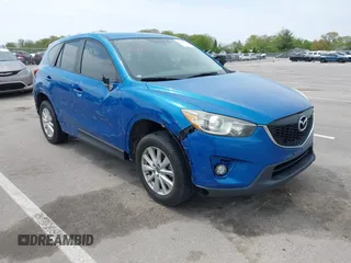2014 Mazda CX-5 Touring z VIN JM3KE4CY3E0326151, wystawiony jako IAAI lot #42180366 z przebiegiem 106 170 mil mil oraz . Historia ofert i sprzedaży dostępna na DreamBid. Obrazek 1.