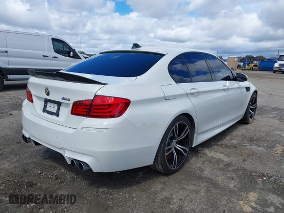 2013 BMW M5 with VIN WBSFV9C56DC772961, listed as a IAAI auction lot 41765457 with 104,568 mi miles. Bid and sale history available at carsss.com. Image 4.
