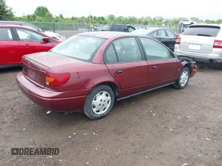 2001 Saturn SL z VIN 1G8ZG52821Z290428, wystawiony jako IAAI lot #42204275 z przebiegiem 171 478 mil mil oraz . Historia ofert i sprzedaży dostępna na DreamBid. Obrazek 4.