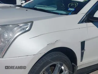 2011 Cadillac SRX Premium Collection z VIN 3GYFNCEYXBS579760, wystawiony jako IAAI lot #42238707 z przebiegiem Nie podano mil oraz . Historia ofert i sprzedaży dostępna na DreamBid. Obrazek 16.
