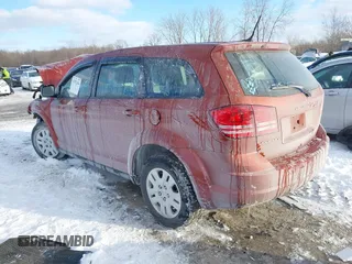 2014 Dodge Journey SE with VIN 3C4PDCAB0ET164105, listed as a IAAI auction lot 41592204 with 133,883 mi miles and . Bid and sale history available at carsss.com. Image 3.