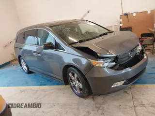 2013 Honda Odyssey Touring with VIN 5FNRL5H95DB068980, listed as a IAAI auction lot 41067336 with 181,185 mi miles and . Bid and sale history available at carsss.com. Image 1.