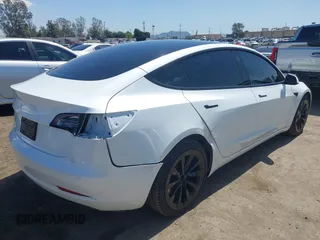 2022 Tesla Model 3 Long Range with VIN 5YJ3E1EB1NF289719, listed as a IAAI auction lot 41968273 with 73,368 mi miles and . Bid and sale history available at DreamBid. Image 4.