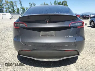 2022 Tesla Model Y Performance with VIN 7SAYGDEF3NF384161, listed as a Copart auction lot 59989145 with 12,731 mi miles and Salvage title. Bid and sale history available at DreamBid. Image 6.