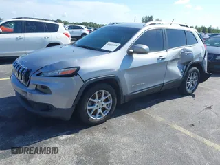 2014 Jeep Cherokee Latitude with VIN 1C4PJLCS6EW103423, listed as a IAAI auction lot 40118289 with 112,120 mi miles and . Bid and sale history available at DreamBid. Image 2.