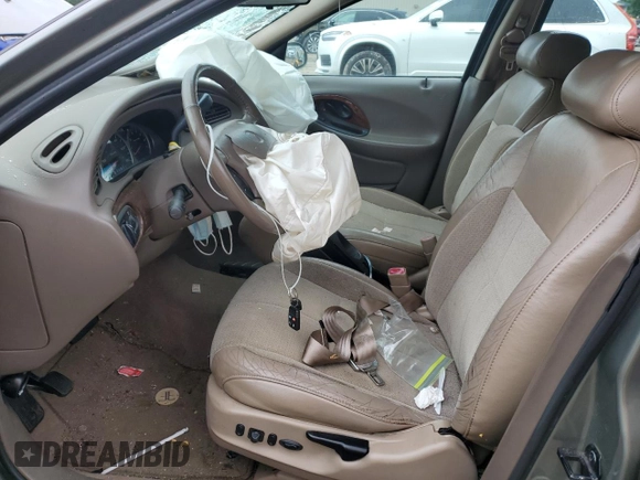 1999 Mercury Sable LS with VIN 1MEFM53U6XG646248, listed as a Copart auction lot 57859405 with 128,286 mi miles and Salvage title. Bid and sale history available at DreamBid. Image 7.