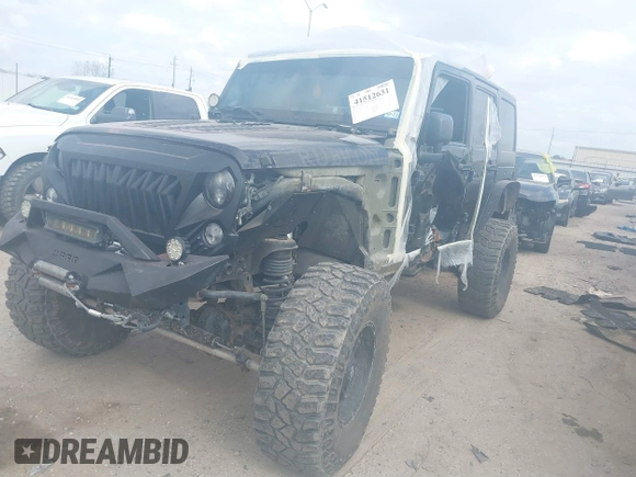 2014 Jeep Wrangler Unlimited Rubicon X with VIN 1C4HJWFG3EL274905, listed as a IAAI auction lot 41512631 with 123,961 mi miles and . Bid and sale history available at DreamBid. Image 2.