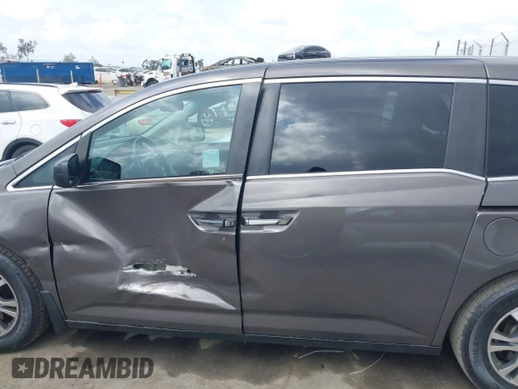 2011 Honda Odyssey EX-L with VIN 5FNRL5H61BB072124, listed as a IAAI auction lot 42115299 with 155,086 mi miles and . Bid and sale history available at DreamBid. Image 14.