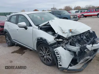 2016 Mazda CX-3 Grand Touring with VIN JM1DKDD78G0134176, listed as a IAAI auction lot 40919339 with 122,627 mi miles. Bid and sale history available at carsss.com. Image 1.