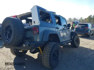 2014 Jeep Wrangler Unlimited Rubicon with VIN 1C4BJWFG3EL248164, listed as a IAAI auction lot 41290490 with 116,383 mi miles. Bid and sale history available at carsss.com. Image 4.