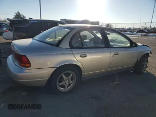 1999 Saturn SL z VIN 1G8ZK5272XZ163225, wystawiony jako Copart lot #41788725 z przebiegiem 144 999 mil mil oraz Szkoda całkowita • Salvage title. Historia ofert i sprzedaży dostępna na DreamBid. Obrazek 3.