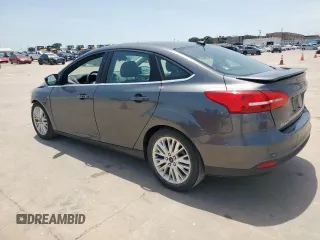 2017 Ford Focus Titanium with VIN 1FADP3J20HL253446, listed as a Copart auction lot 64196895 with 150,633 mi miles and Salvage title. Bid and sale history available at DreamBid. Image 2.