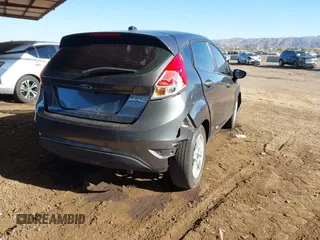 2019 Ford Fiesta SE with VIN 3FADP4EJ8KM101816, listed as a IAAI auction lot 41615459 with 71,028 mi miles. Bid and sale history available at carsss.com. Image 4.