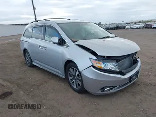 2014 Honda Odyssey Touring with VIN 5FNRL5H93EB066162, listed as a IAAI auction lot 41734783 with 173,063 mi miles and . Bid and sale history available at DreamBid. Image 1.