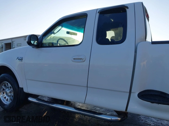 2003 Ford F-150 z VIN 2FTRX08W63CA22223, wystawiony jako IAAI lot #41382377 z przebiegiem 261 841 mil mil oraz . Historia ofert i sprzedaży dostępna na DreamBid. Obrazek 14.