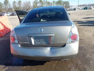 2004 Nissan Altima S with VIN 1N4AL11D24C102557, listed as a IAAI auction lot 41663563 with 151,144 mi miles. Bid and sale history available at carsss.com. Image 16.