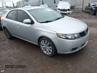 2010 Kia Forte SX with VIN KNAFW4A39A5230517, listed as a IAAI auction lot 41953297 with 154,711 mi miles. Bid and sale history available at carsss.com. Image 1.