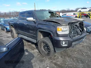 2015 GMC Sierra 2500HD available WiFi Denali with VIN 1GT120E84FF158909, listed as a IAAI auction lot 41203805 with 56,498 mi miles. Bid and sale history available at carsss.com. Image 1.