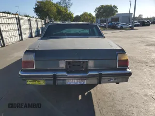 1984 Oldsmobile 88 z VIN 1G3AN69Y0EM827157, wystawiony jako Copart lot #82609024 z przebiegiem 525 834 mil mil oraz Czysty tytuł • Clean title. Historia ofert i sprzedaży dostępna na DreamBid. Obrazek 6.