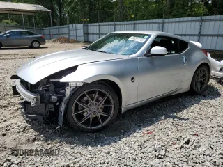 2009 Nissan 370Z z VIN JN1AZ44E79M408415, wystawiony jako Copart lot #59391275 z przebiegiem 136 727 mil mil oraz Szkoda całkowita • Salvage title. Historia ofert i sprzedaży dostępna na DreamBid. Obrazek 1.