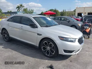 2014 Ford Taurus SHO with VIN 1FAHP2KT4EG128618, listed as a IAAI auction lot 41786867 with 116,825 mi miles. Bid and sale history available at carsss.com. Image 1.
