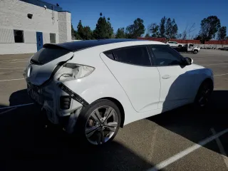 2016 Hyundai Veloster with VIN KMHTC6AD2GU289258, listed as a Copart auction lot 65821443 with 64,420 mi miles. Bid and sale history available at carsss.com. Image 3.