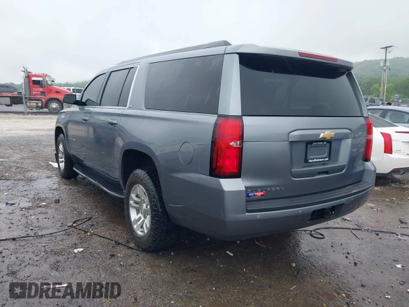 2019 Chevrolet Suburban LT with VIN 1GNSKHKCXKR405555, listed as a IAAI auction lot 42188860 with 143,435 mi miles and . Bid and sale history available at DreamBid. Image 3.