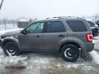 2012 Ford Escape XLS z VIN 1FMCU9C72CKA10130, wystawiony jako IAAI lot #41543233 z przebiegiem 168 552 mil mil oraz . Historia ofert i sprzedaży dostępna na DreamBid. Obrazek 14.