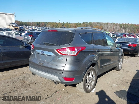 2014 Ford Escape Titanium with VIN 1FMCU9J94EUC50534, listed as a IAAI auction lot 41040341 with 115,502 mi miles. Bid and sale history available at carsss.com. Image 4.