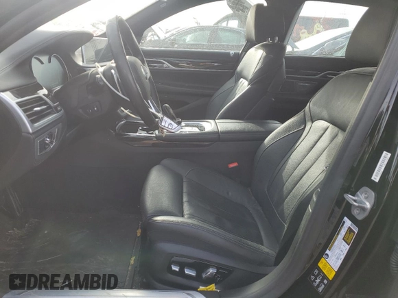 2019 BMW 7 Series 740i xDrive z VIN WBA7E4C50KGV28241, wystawiony jako Copart lot #87329774 z przebiegiem Nie podano mil oraz Szkoda całkowita • Salvage title. Historia ofert i sprzedaży dostępna na DreamBid. Obrazek 7.