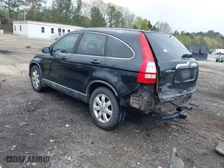 2009 Honda CR-V EX with VIN 5J6RE38569L014534, listed as a IAAI auction lot 41919768 with 220,590 mi miles. Bid and sale history available at carsss.com. Image 3.