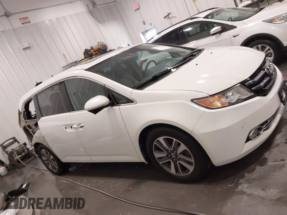 2015 Honda Odyssey Touring Elite with VIN 5FNRL5H92FB020159, listed as a IAAI auction lot 42103240 with 79,322 mi miles and . Bid and sale history available at DreamBid. Image 14.