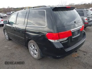 2010 Honda Odyssey Touring with VIN 5FNRL3H95AB040354, listed as a IAAI auction lot 41889501 with 155,069 mi miles. Bid and sale history available at carsss.com. Image 3.