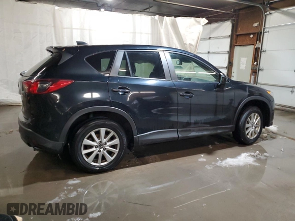 2015 Mazda CX-5 Touring with VIN JM3KE4CY1F0458911, listed as a Copart auction lot 87666255 with 0 mi miles and Salvage Title. Bid and sale history available at carsss.com. Image 3.