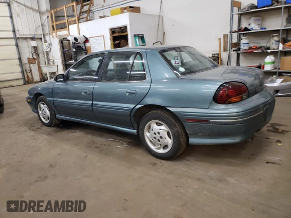 1997 Pontiac Grand Am SE with VIN 1G2NE52M8VC721326, listed as a Copart auction lot 75860034 with 110,209 mi miles and Salvage title. Bid and sale history available at DreamBid. Image 2.
