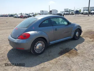 2014 Volkswagen Beetle 2.5L with VIN 3VWJX7AT7EM608634, listed as a IAAI auction lot 41783090 with 139,106 mi miles and . Bid and sale history available at DreamBid. Image 4.