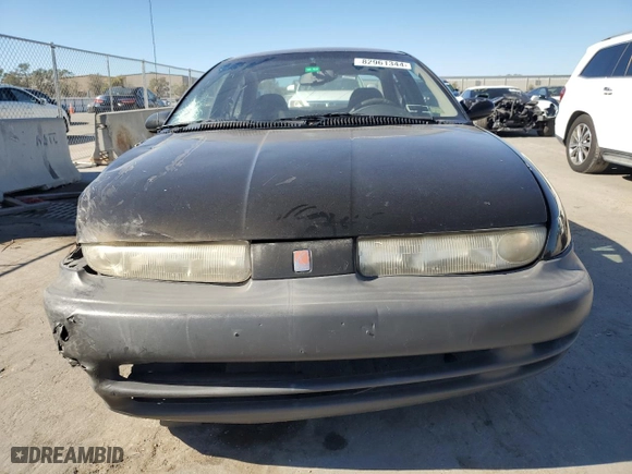 1997 Saturn SL with VIN 1G8ZH5285VZ238858, listed as a Copart auction lot 82961344 with 166,226 mi miles and Salvage Title. Bid and sale history available at carsss.com. Image 5.