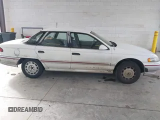 1992 Mercury Sable z VIN 1MECM5049NG647978, wystawiony jako IAAI lot #41805346 z przebiegiem 23 634 mil mil oraz . Historia ofert i sprzedaży dostępna na DreamBid. Obrazek 13.