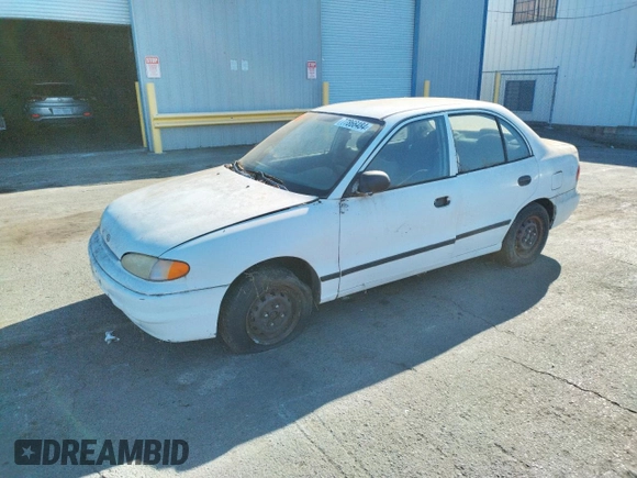 1997 Hyundai Accent z VIN KMHVF24NXVU373676, wystawiony jako Copart lot #77866484 z przebiegiem 151 949 mil mil oraz Tytuł czysty. Historia ofert i sprzedaży dostępna na DreamBid. Obrazek 1.
