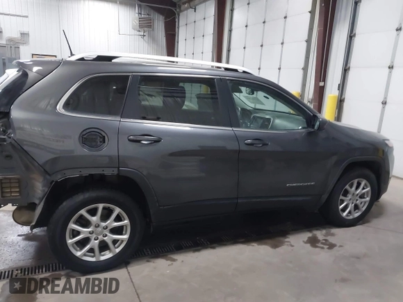 2016 Jeep Cherokee Latitude z VIN 1C4PJMCB1GW367092, wystawiony jako IAAI lot #41101266 z przebiegiem 96 500 mil mil oraz . Historia ofert i sprzedaży dostępna na DreamBid. Obrazek 13.