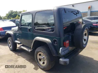 2000 Jeep Wrangler Sport with VIN 1J4FA49S4YP741154, listed as a Copart auction lot 71006864 with 200,684 mi miles and Clean Title. Bid and sale history available at carsss.com. Image 2.