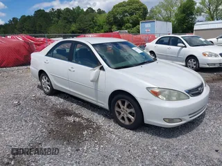2004 Toyota Camry LE with VIN JTDBE32KX40279599, listed as a IAAI auction lot 42202160 with 288,879 mi miles. Bid and sale history available at carsss.com. Image 1.